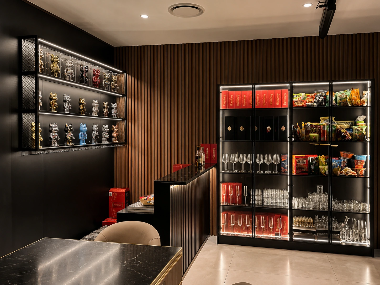 Silverwater entertainment lounge — backlit display cabinets of collectibles and glassware beside a black stone bar