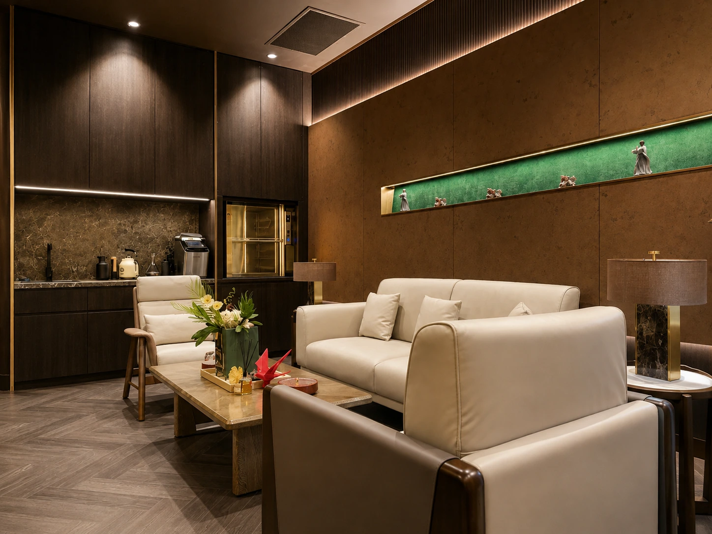 Silverwater sitting lounge — cream leather sofas and dark timber walls with a green backlit display niche beside a servery