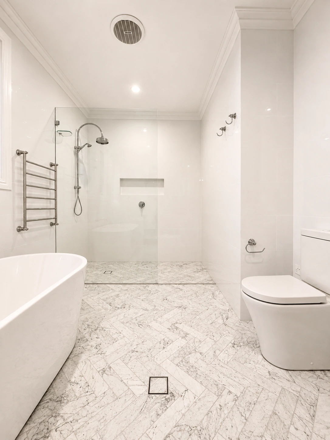 Willoughby bathroom — freestanding bath, walk-in shower and marble herringbone floor